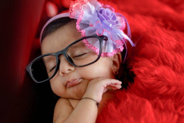 cute Indian baby girl on spectacles